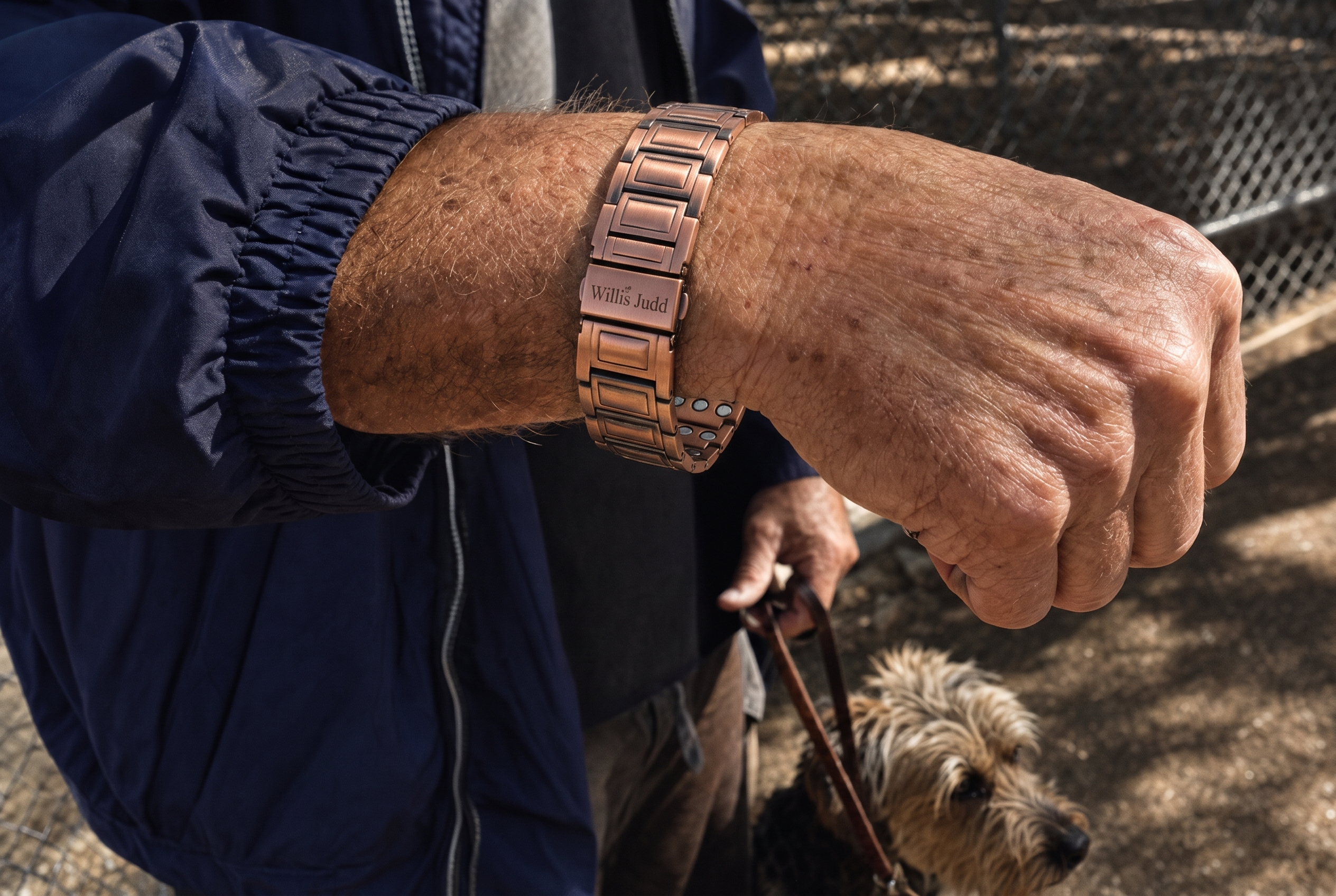 The guy at the dog park. Terrier, one-handed leash clip, and this on his wrist. Illustrative photo.